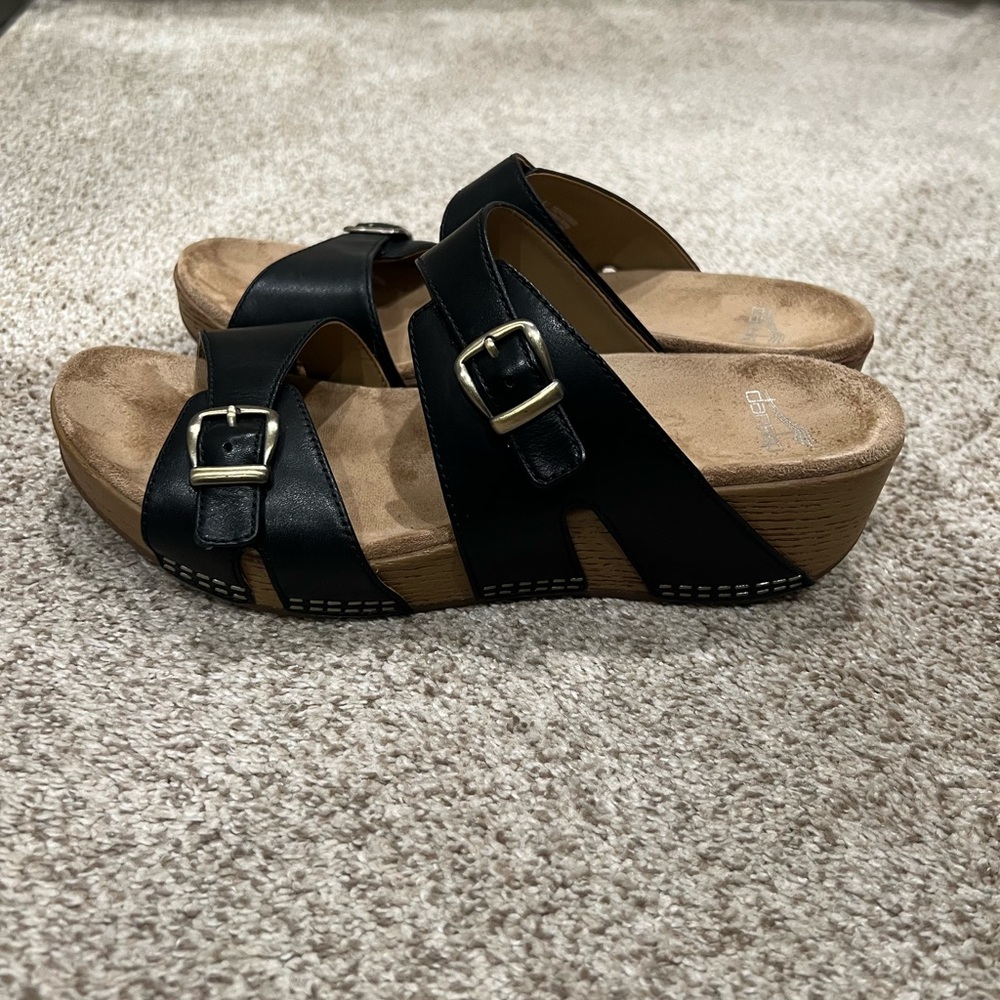 Dansko Black Buckle Wedge Sandals - Women